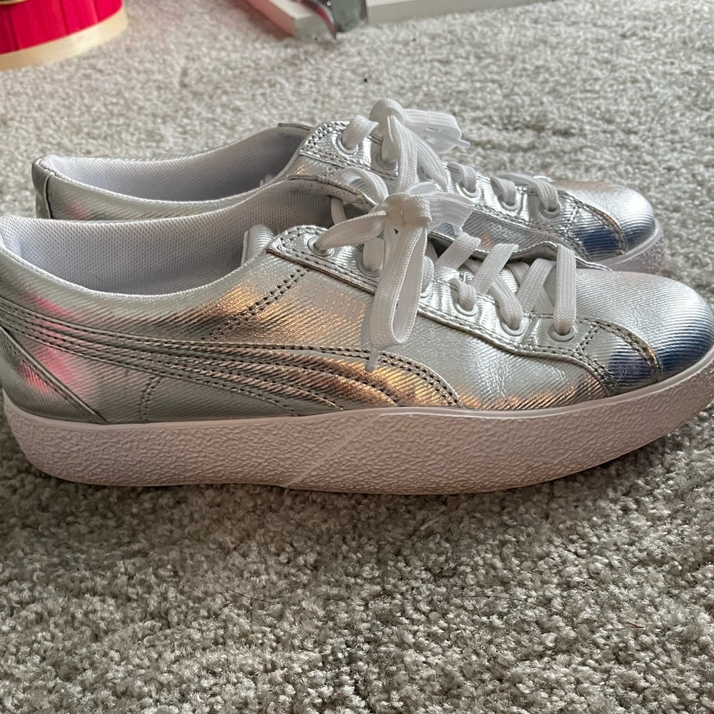 Silver Puma tennis shoes. Never worn